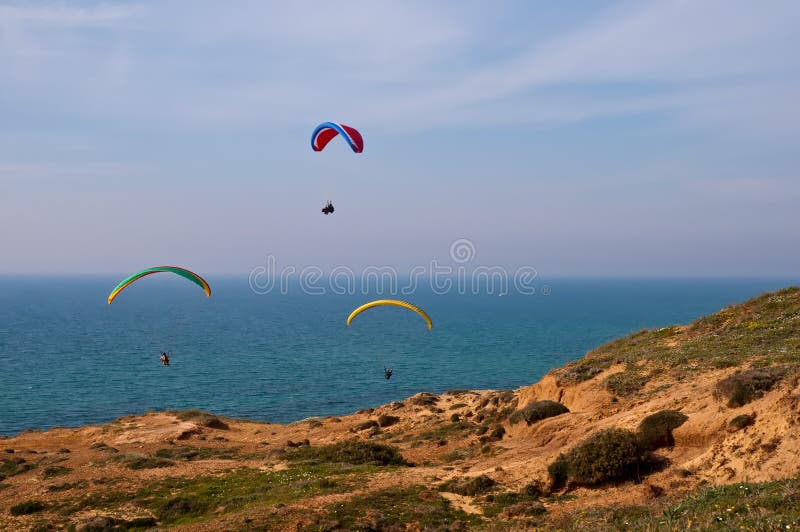 Paraglider over Mediterranean sea .