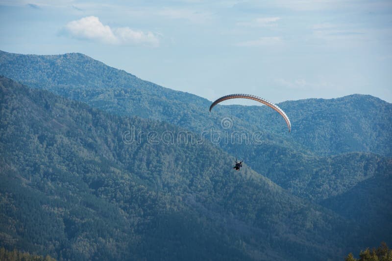 Paragliding in mountains stock photo. Image of blue, dangerous 91810898