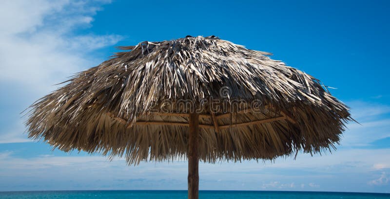 Tropical Beach under umbrella on sunny day. Tropical Beach under umbrella on sunny day