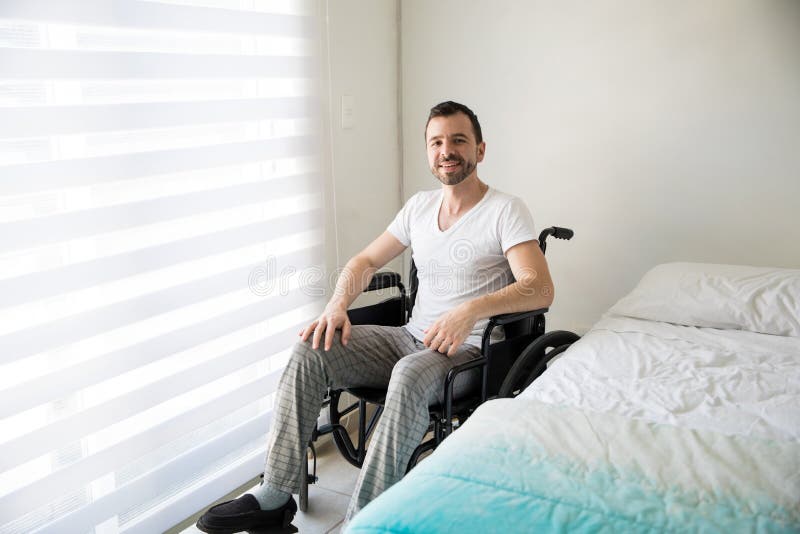 Paralyzed man on a wheelchair at home royalty free stock image Paralyzed man on a wheelchair at home royalty free stock image