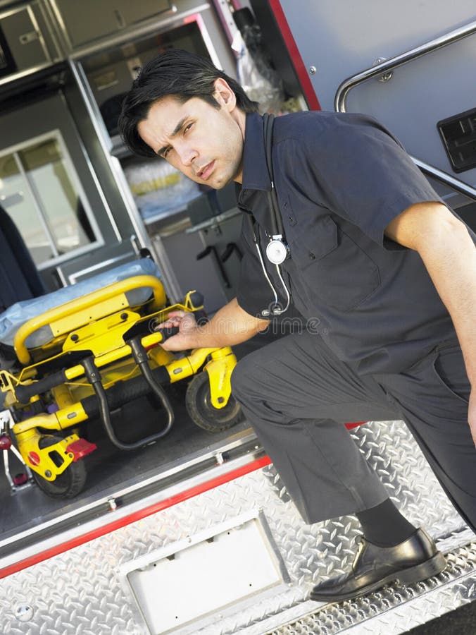 Paramedic Removing Gurney from Ambulance Stock Photo Image of gurney