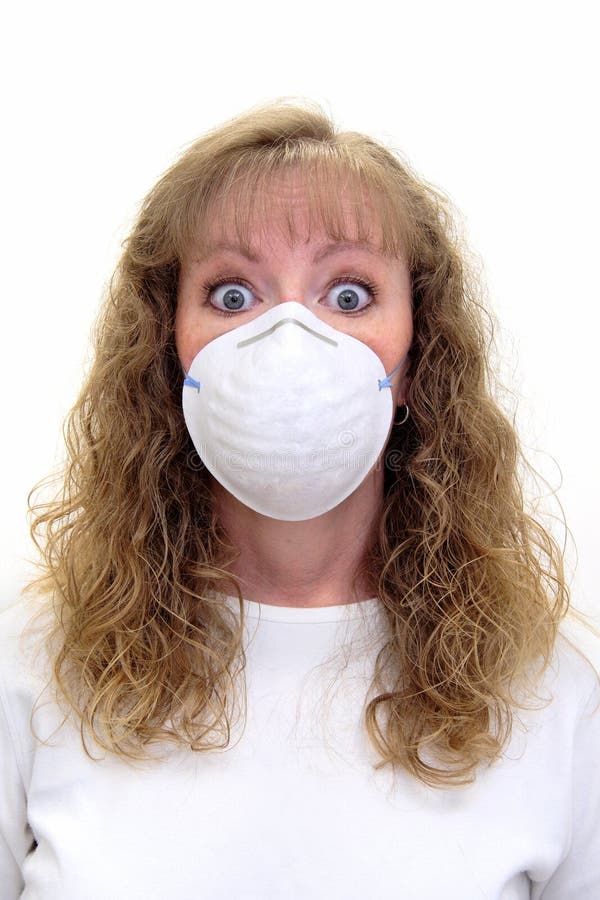 A Paranoid Caucasian woman wears a protective mask stock images