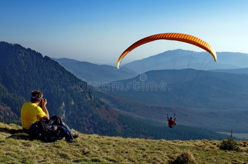 Paraglider over the Ciucas Mountains - landmark attraction in Romania. Paraglider over the Ciucas Mountains - landmark attraction in Romania.