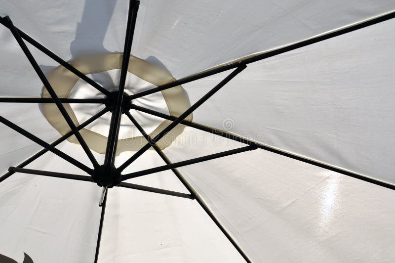 Close up image of white classic sun umbrella. Close up image of white classic sun umbrella