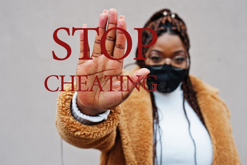 Stop cheating. African american woman, wear black face mask show stop hand sign. Stop cheating. African american woman, wear black face mask show stop hand sign.