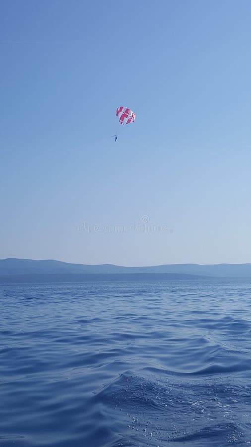 Parasailing in the Adriatic coast in Croatia, Southern Europe - recreational kiting activity royalty free stock images Parasailing in the Adriatic coast in Croatia, Southern Europe - recreational kiting activity royalty free stock images