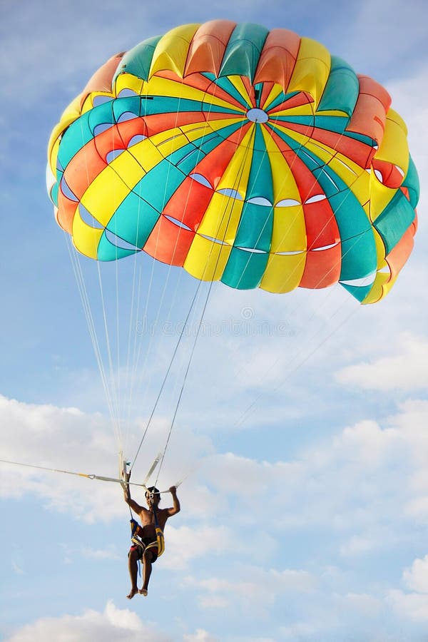 Parasailing on sky background