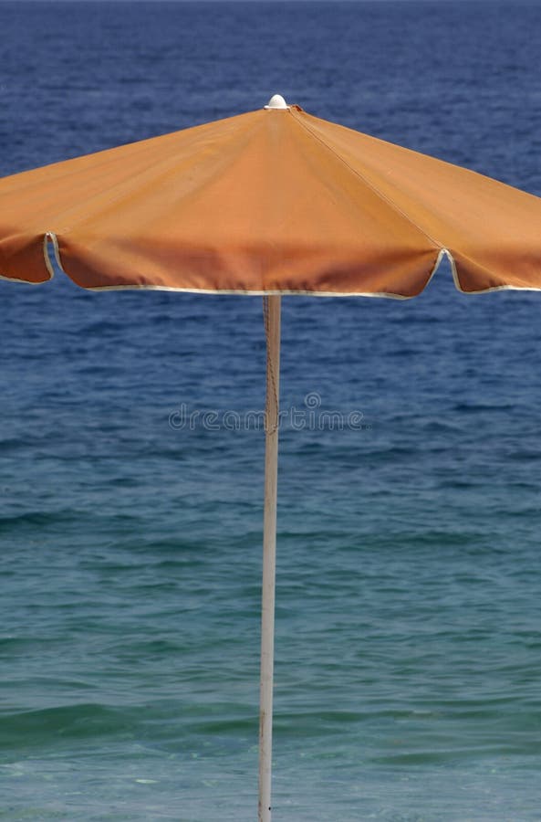 Parasol on the beach stock photo. Image of blue, beach 214114528