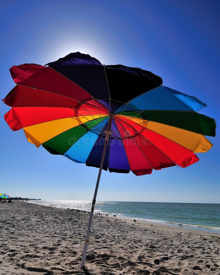 Colorful beach umbrella early in the morning. Colorful beach umbrella early in the morning.