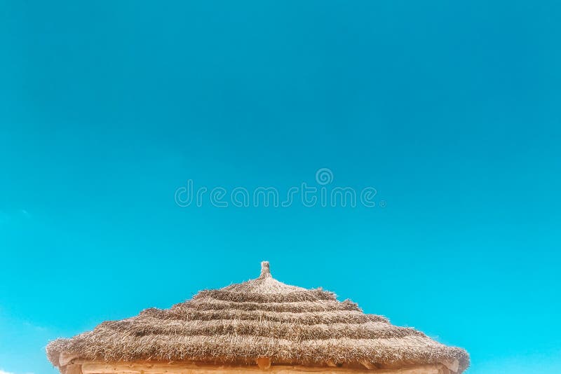 Straw beach umbrella with blue sky . sammer sanny happy. Straw beach umbrella with blue sky . sammer sanny happy