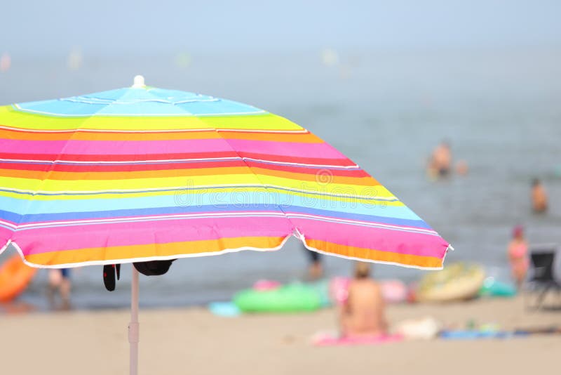 Bedankt Chinese kool kapok Parasol Umbrella on the Beach with Swimmers Having Fun during Th Stock  Photo - Image of beach, rainbow: 224952476