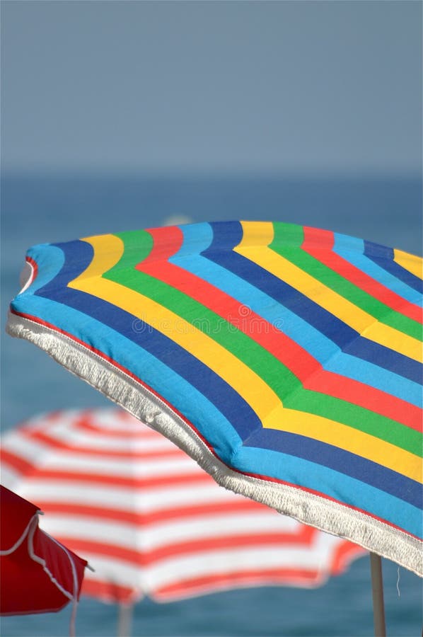 Beach umbrellas of all colors at Marbella beach, Spain. Beach umbrellas of all colors at Marbella beach, Spain.