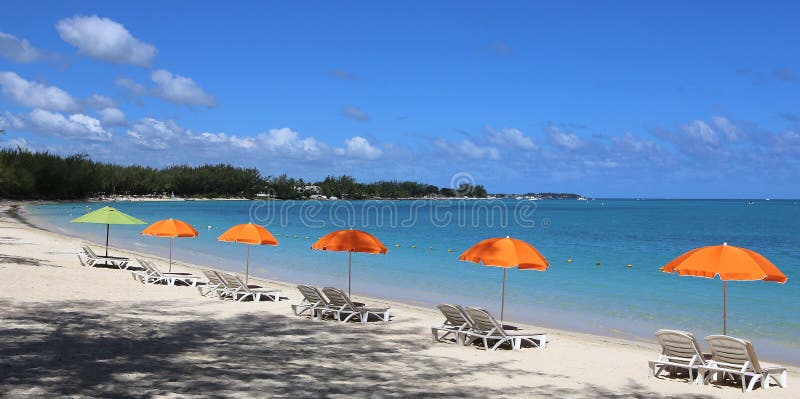 Parasols and lagoon on Mont-Choisy beach, Mauritius island, indian ocean. Parasols and lagoon on Mont-Choisy beach, Mauritius island, indian ocean