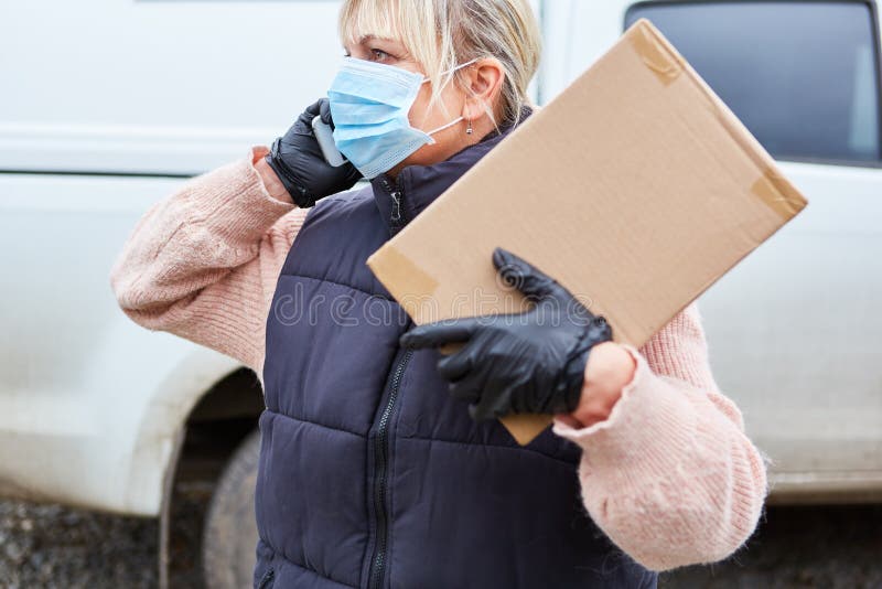 The Parcel Carrier of a Delivery Service Calls the Recipient Stock