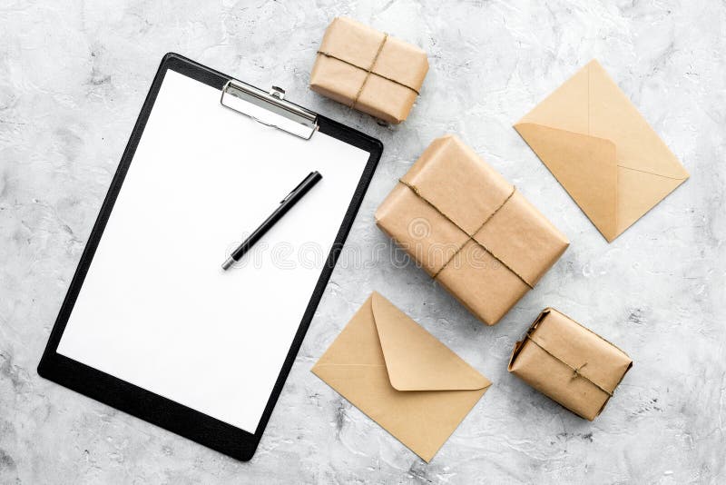 Parcels box delivery on stone background top view mock up royalty free stock photography Parcels box delivery on stone background top view mock up royalty free stock photography