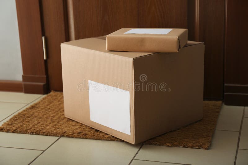 Parcels on rug. Delivery service royalty free stock photo