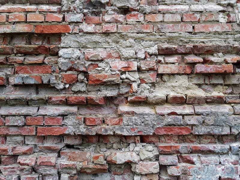 Pared Agrietada Abandonada Del Estuco Del Ladrillo Del Grunge Imagen de