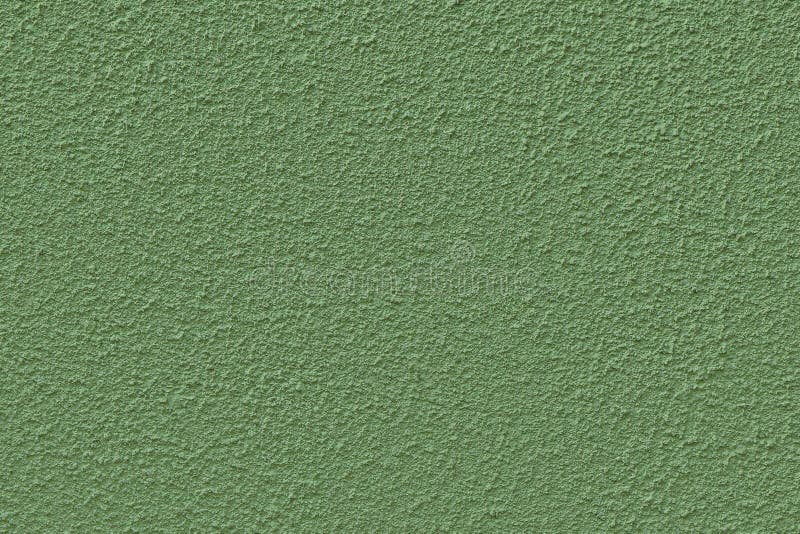 A parede coberta com reboco texturizado e pintada de verde, textura contínua fotografia de stock