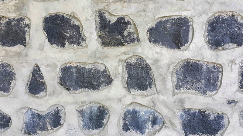 Cerca decorativa de pedra a granel na grade fundo texturizado de uma parede  de pedra com rede de ferro parede de pedra em armação de arame gabião  preenchido com calcário