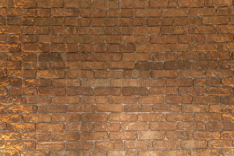 A parede de tijolo marrom vermelha do bloco arranjou belamente o fundo da textura imagem de stock A parede de tijolo marrom vermelha do bloco arranjou belamente o fundo da textura imagem de stock