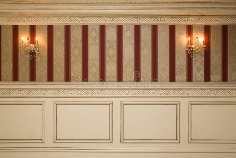 Formal interior wall with wallpaper, sconces and paneling. Formal interior wall with wallpaper, sconces and paneling