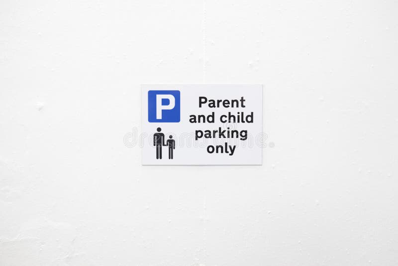 Parent and child parking space only sign in car park on blank white wall royalty free stock image Parent and child parking space only sign in car park on blank white wall royalty free stock image