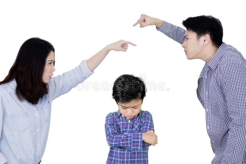 Parents arguing in front of their sad son on studio royalty free stock photo