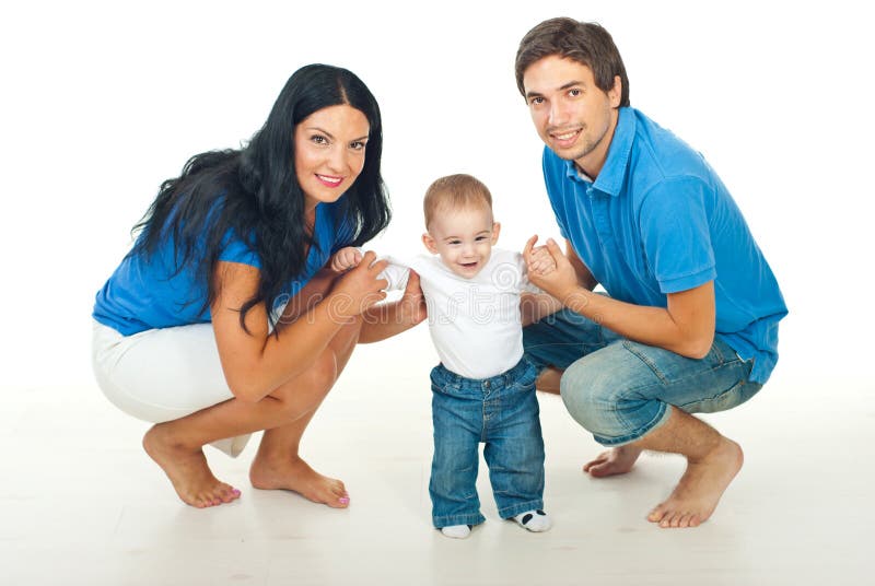 Parents with baby making first steps