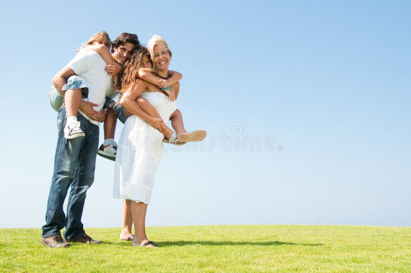 Parents giving piggyback rides