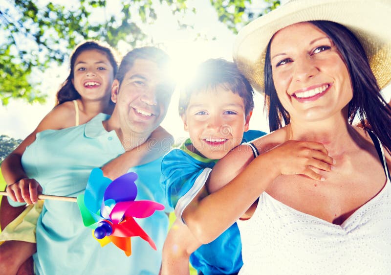 Parents Giving Their Kids A Piggy Back At Outdoors royalty free stock photo Parents Giving Their Kids A Piggy Back At Outdoors royalty free stock photo