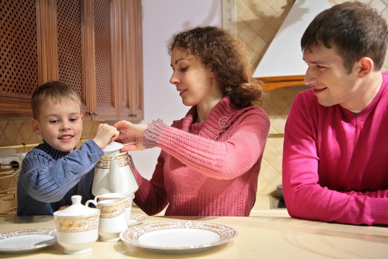 Parents with son at tea