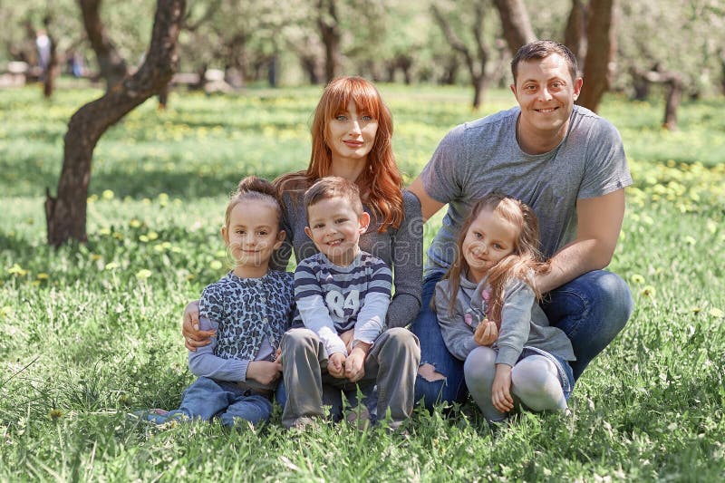 Parents with their children on spring garden background royalty free stock image Parents with their children on spring garden background royalty free stock image