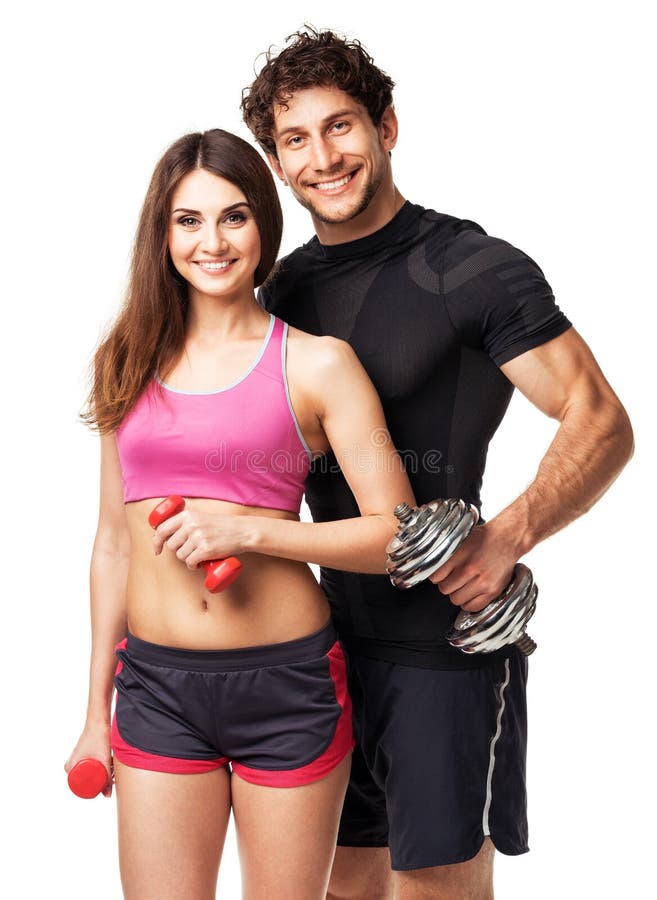 Pares atléticos - homem e mulher com pesos no branco foto de stock Pares atléticos - homem e mulher com pesos no branco foto de stock