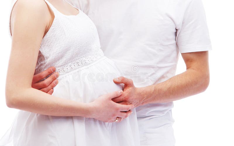 Pares atrativos novos: mãe e pai grávidos imagens de stock Pares atrativos novos: mãe e pai grávidos imagens de stock