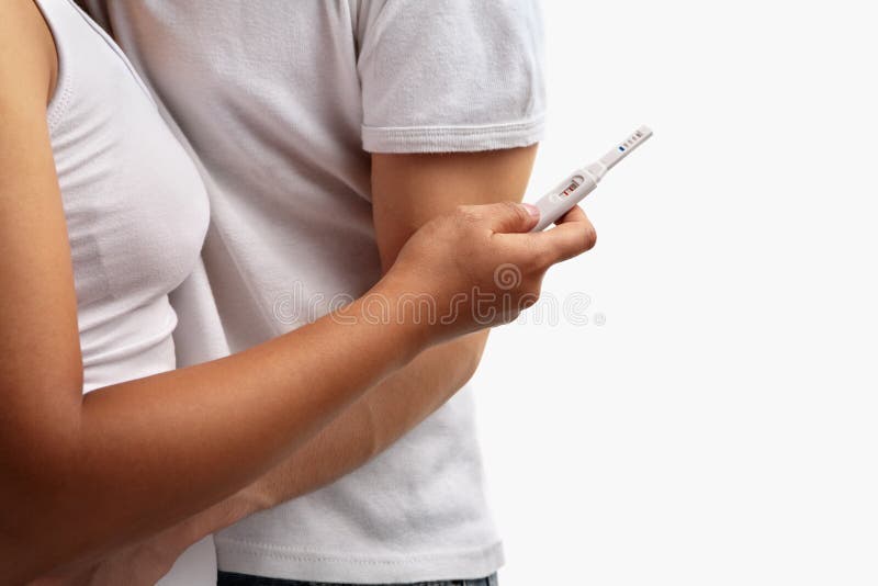 Couple with positive pregnancy test over white background. Couple with positive pregnancy test over white background