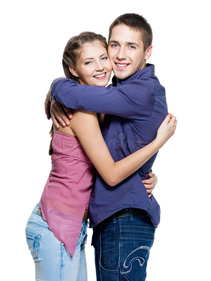 Pares de sorriso adolescentes felizes novos foto de stock Pares de sorriso adolescentes felizes novos foto de stock