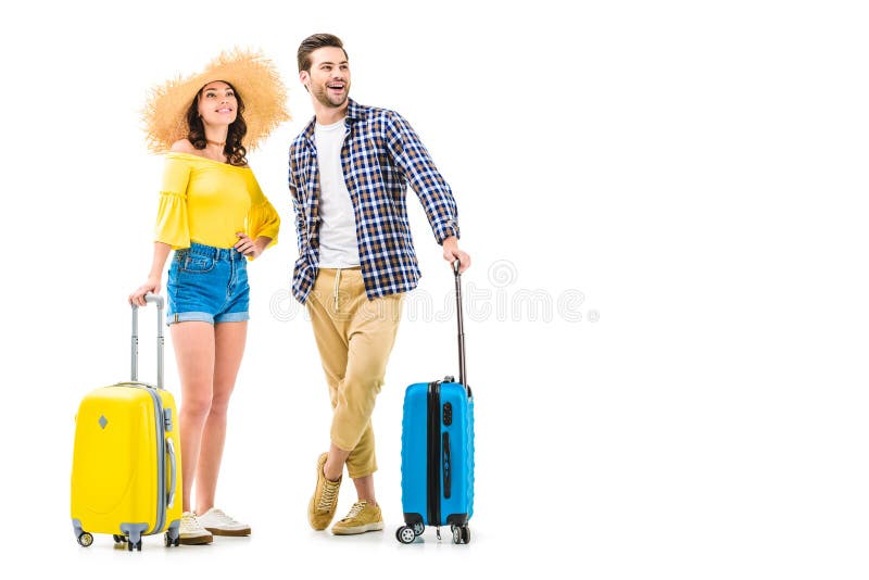 Pares de turistas que guardam bagagens fotografia de stock Pares de turistas que guardam bagagens fotografia de stock