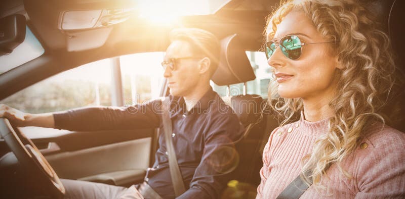 Couple driving car during test drive. Couple driving car during test drive