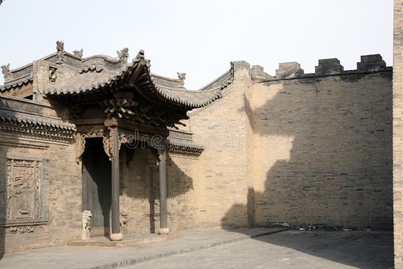 shanxi Pingyao Ancient Town is one of the four best-preserved ancient cities in China. Being prosperous and well developed in both Ming and Qing dynasties as a financial and business center, Pingyao was the assembly place of wealthy merchants who built the eye-catching courtyards one after the other, thus made the town the typical folk house in northern China. With more than 1700 years history, the Shanxi ancient town is the birthplace of the earliest bank in China, named Piaohao, means the firm for exchanging and transferring of money. Old door, Ancient architecture, brick wall ,shanxi north china ,. shanxi Pingyao Ancient Town is one of the four best-preserved ancient cities in China. Being prosperous and well developed in both Ming and Qing dynasties as a financial and business center, Pingyao was the assembly place of wealthy merchants who built the eye-catching courtyards one after the other, thus made the town the typical folk house in northern China. With more than 1700 years history, the Shanxi ancient town is the birthplace of the earliest bank in China, named Piaohao, means the firm for exchanging and transferring of money. Old door, Ancient architecture, brick wall ,shanxi north china ,