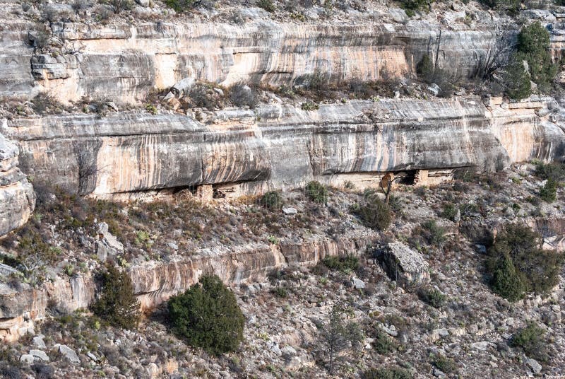 Vertical wall with ancient cliff dwellings in Walnut Canyon National Monument in Arizona, United States of America. Vertical wall with ancient cliff dwellings in Walnut Canyon National Monument in Arizona, United States of America