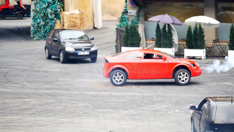 Paris, France - April 2019: Stuntmen thrilling exhibition chase with cars at Motor show