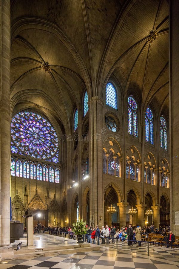 Paris France April 29th 2013 Interior view of Notre Dame Cathedral, including the famous stained glass windows stock photo Paris France April 29th 2013 Interior view of Notre Dame Cathedral, including the famous stained glass windows stock photo