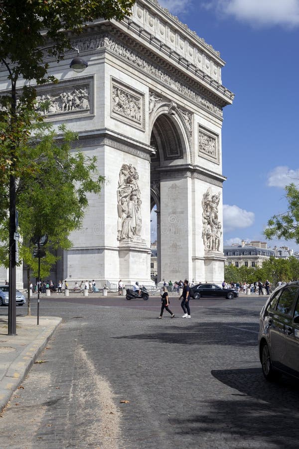 Paris, France - August 20, 2022: The Arc de Triomphe is a monument in the 8th arrondissement of Paris on Place Charles de Gaulle, erected in 1806-1836 according to the design of the French Empire architect Jean-Francois Chalgrin