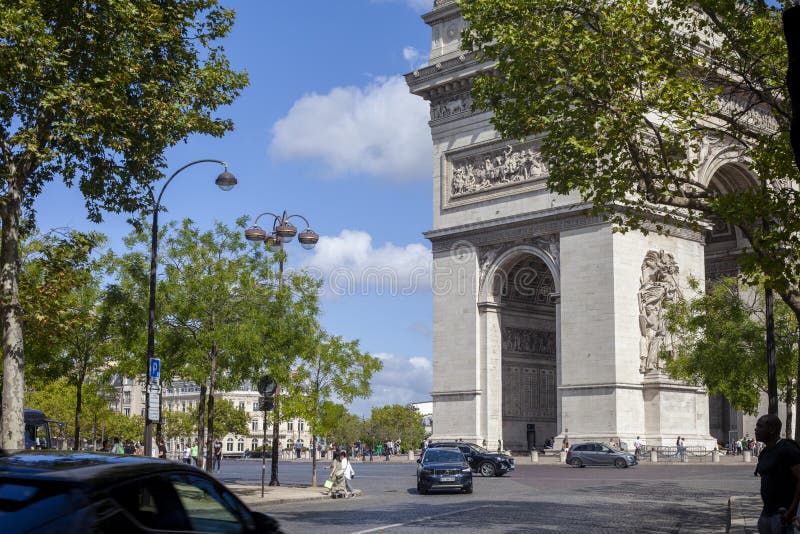 Paris, France - August 20, 2022: The Arc de Triomphe is a monument in the 8th arrondissement of Paris on Place Charles de Gaulle, erected in 1806-1836 according to the design of the French Empire architect Jean-Francois Chalgrin