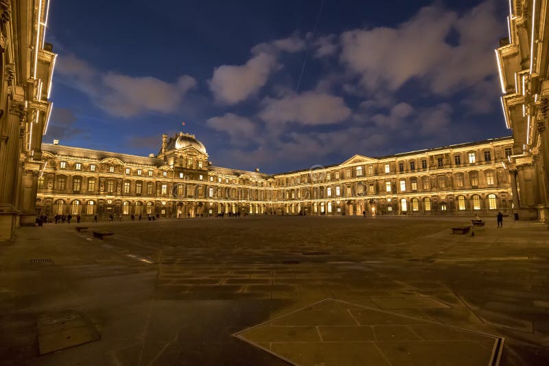 The Louvre Museum inner courtyard illuminated at night stock images The Louvre Museum inner courtyard illuminated at night stock images