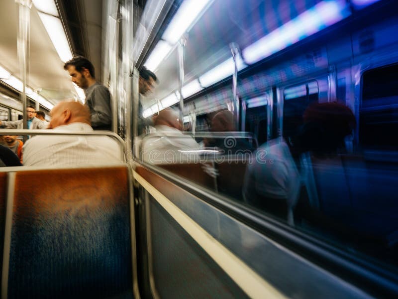 People waiting for a train on Opéra metro station in Paris .The