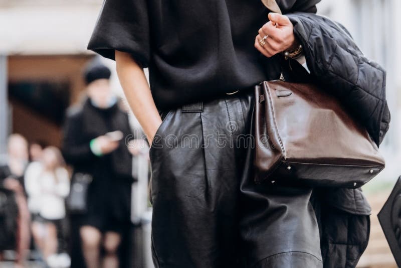 Paris, France - October, 3, 2021: Woman Wears Handbag Hermes Kelly