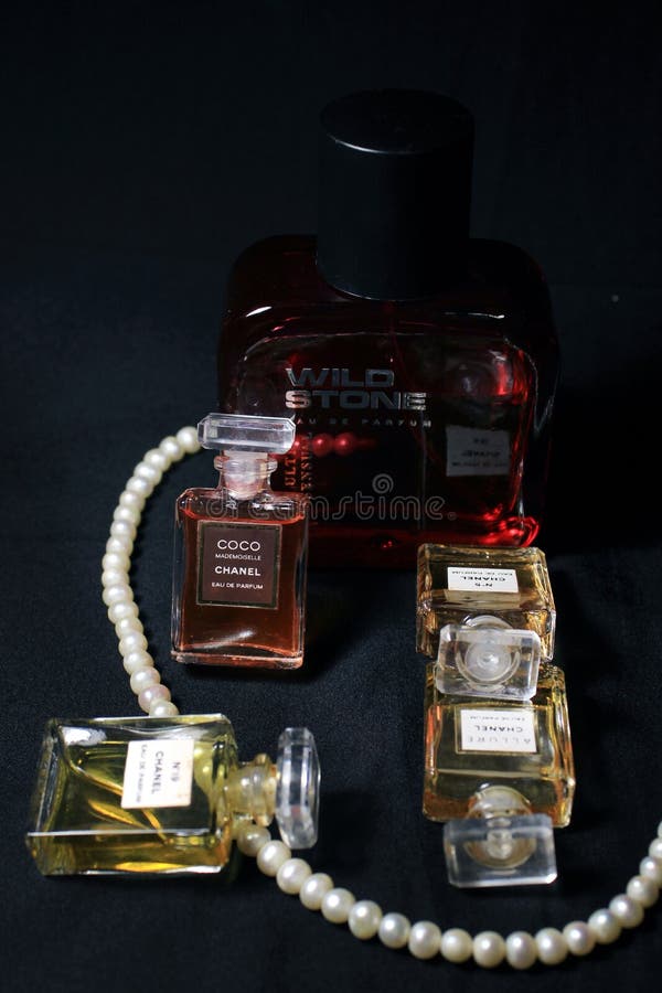 Chanel Perfume Bottles Isolated on Red Background. Bottle with Coco Chanel  & N`5 Chanel Perfume Product. Editorial Photo - Image of famous, colorful:  182848621