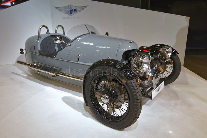 The Morgan Motor Company announced that they would launch the 3 Wheeler in 2011 at the Geneva Motor Show. The 3 Wheeler was initially said to have a Harley-Davidson Screaming Eagle V-twin engine and a Mazda 5-speed manual transmission, and was estimated to deliver 115 horsepower 86 kW at the rear wheel. However, there was a surprise when the prototype that was shown at Geneva had an S&S engine. Production three-wheelers turned out to have S&S engines. The kerb weight was originally estimated to be less than 500 kilograms 1,102 lb, but the final weight was tested at 550 kg 1,212 lb. The acceleration from zero to 60 mph 97 km/h was estimated by Morgan as 4.5 seconds, with an estimated top speed of 115 mph 185 km/h. The Morgan Motor Company announced that they would launch the 3 Wheeler in 2011 at the Geneva Motor Show. The 3 Wheeler was initially said to have a Harley-Davidson Screaming Eagle V-twin engine and a Mazda 5-speed manual transmission, and was estimated to deliver 115 horsepower 86 kW at the rear wheel. However, there was a surprise when the prototype that was shown at Geneva had an S&S engine. Production three-wheelers turned out to have S&S engines. The kerb weight was originally estimated to be less than 500 kilograms 1,102 lb, but the final weight was tested at 550 kg 1,212 lb. The acceleration from zero to 60 mph 97 km/h was estimated by Morgan as 4.5 seconds, with an estimated top speed of 115 mph 185 km/h.