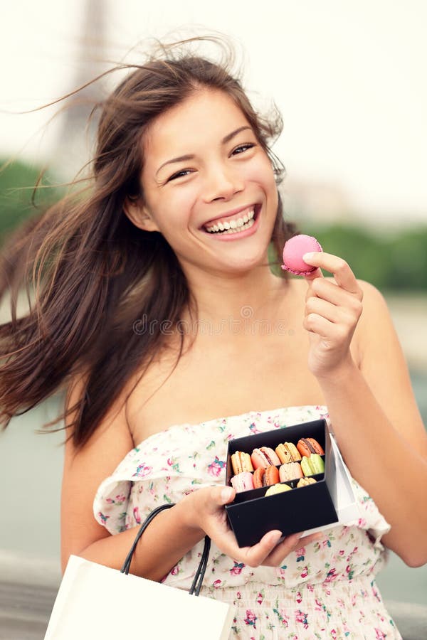 Paris woman eating french macaron royalty free stock photos Paris woman eating french macaron royalty free stock photos